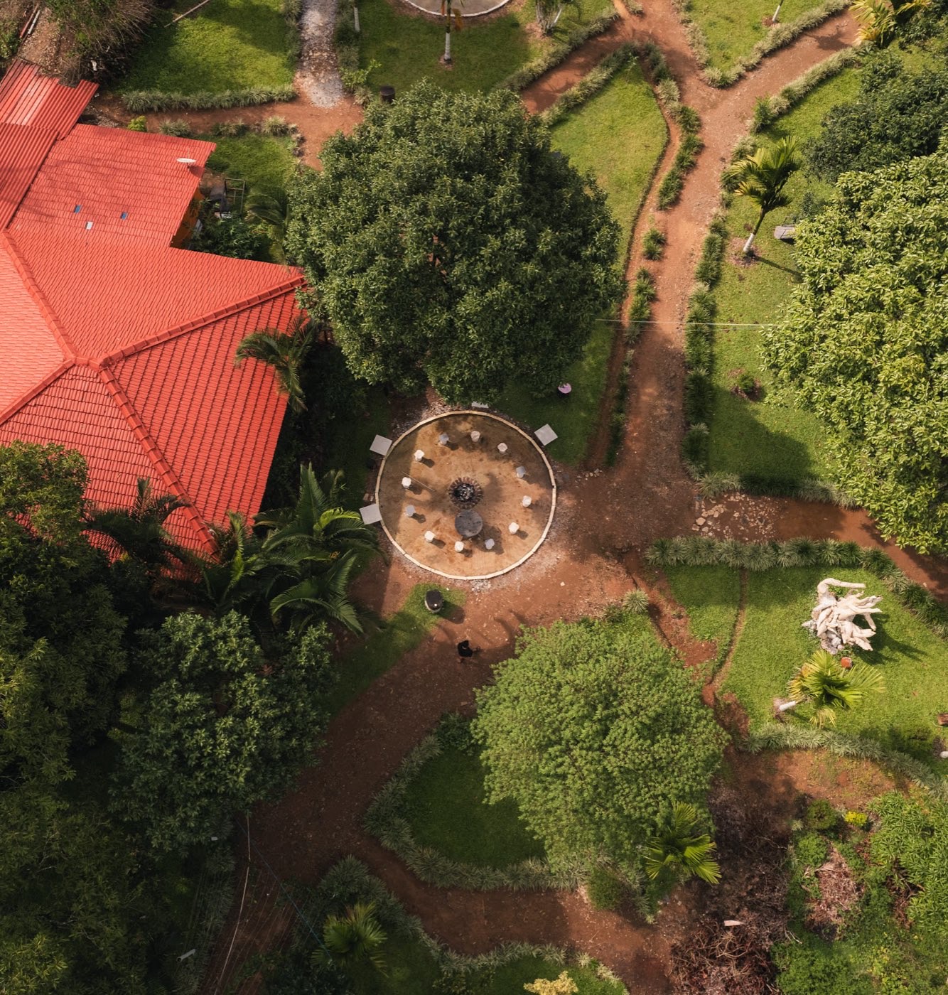 Aerial view of a cottage roof and garden paths